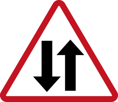 What does a two-way traffic warning sign mean